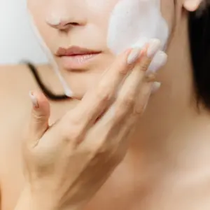 Woman,Using,Exfoliant,On,Face,Microbeads,In,Skincare,Using,Envrionmentally,Friendly,Product.